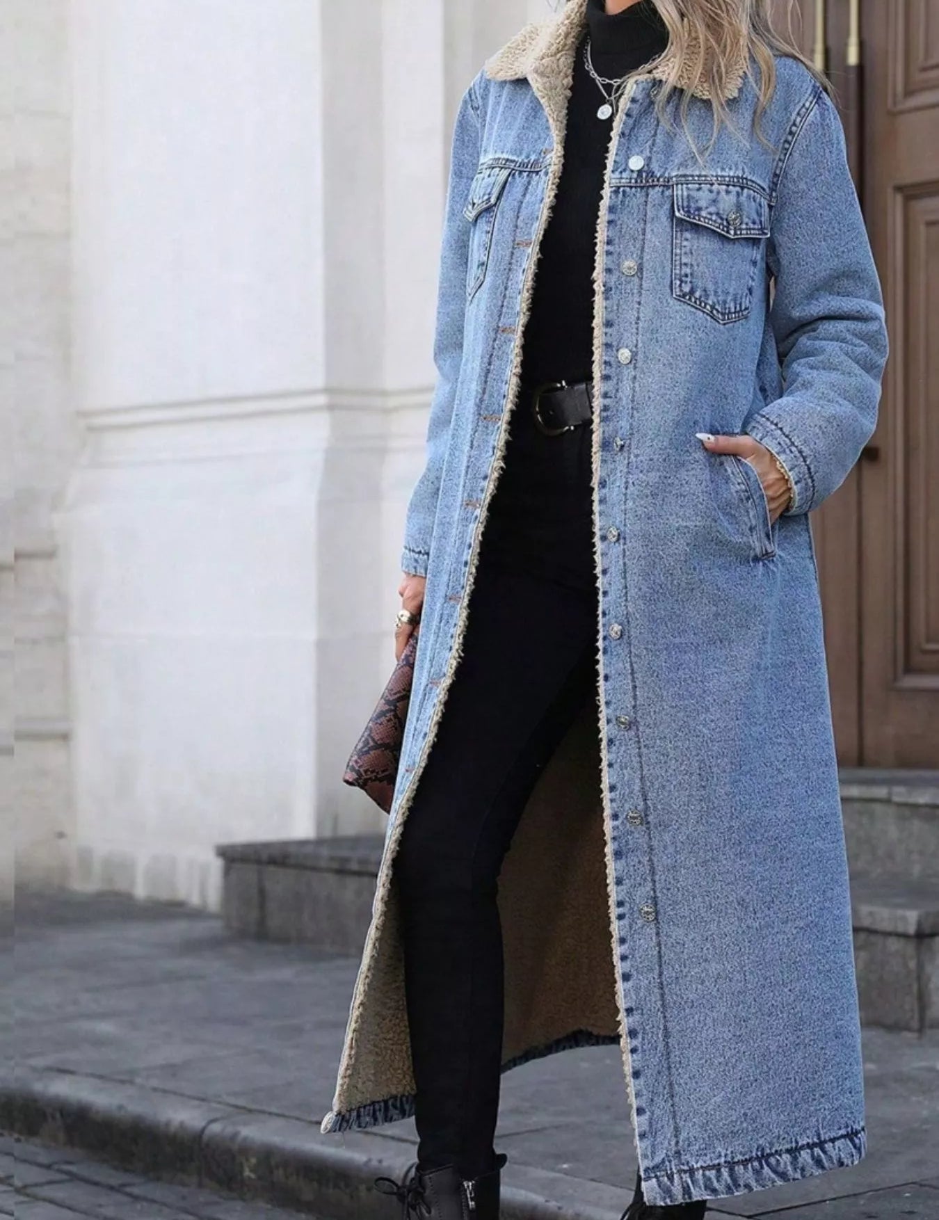 Sherpa Lined Longline Denim Jacket in light blue with fur lining and black buttons