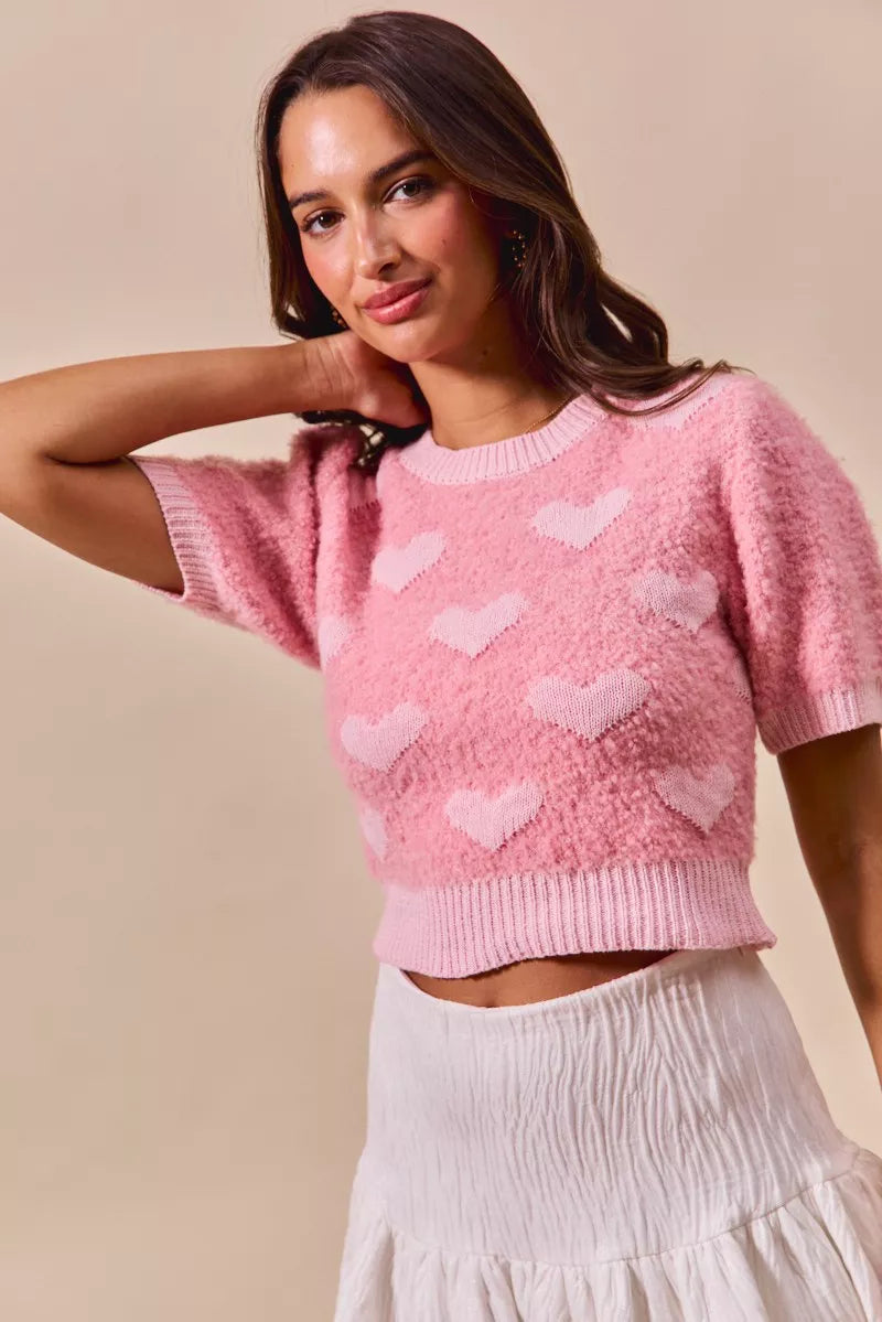 Pink fuzzy cropped sweater with SO ME heart knit details