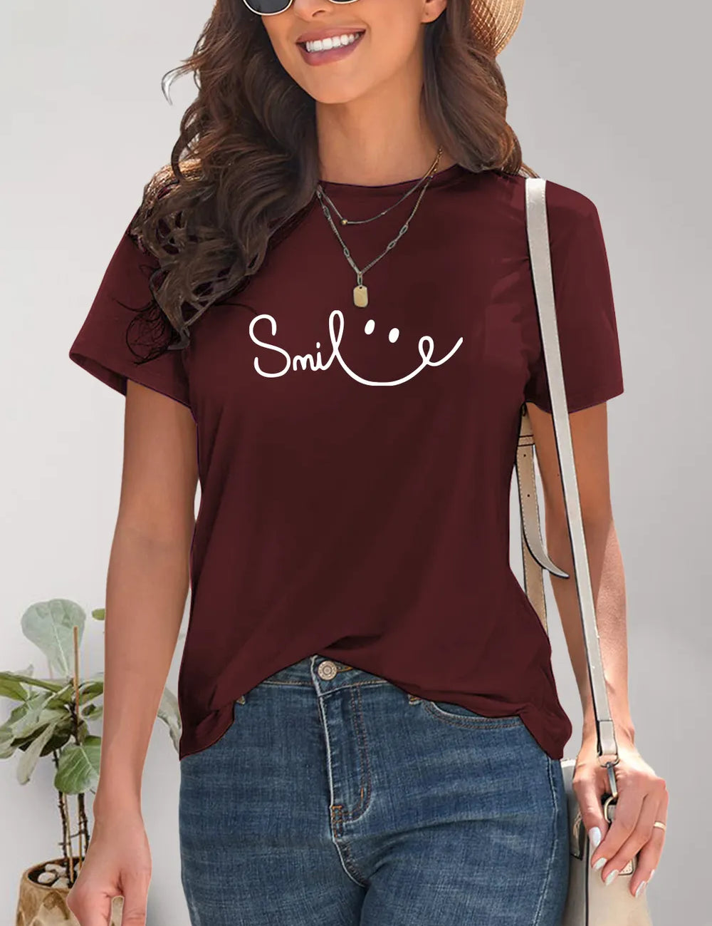 Burgundy short-sleeved SMILE t-shirt with smiley face graphic