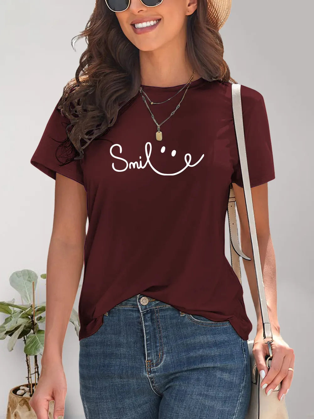 Burgundy short-sleeved SMILE t-shirt with smiley face graphic