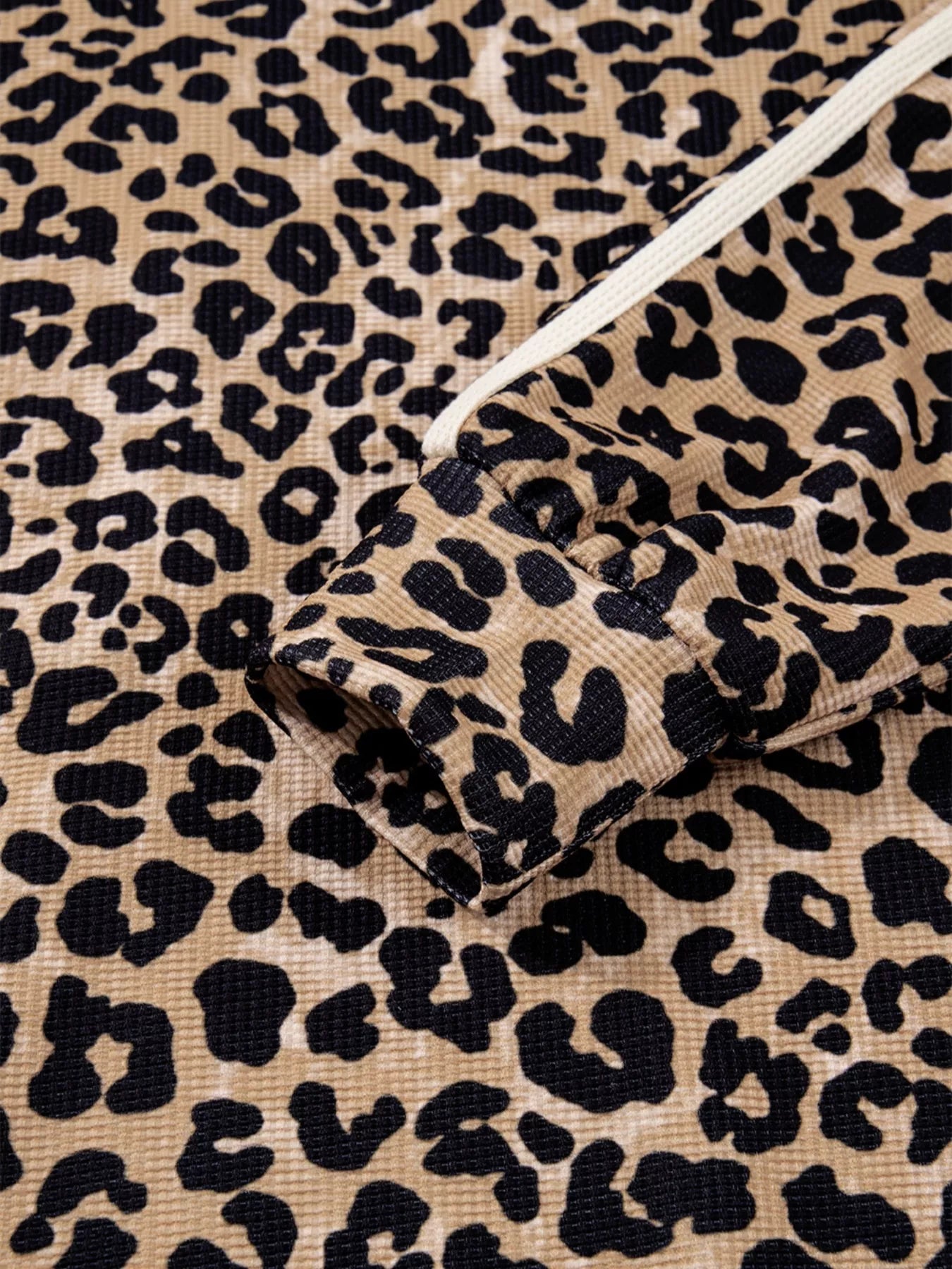 Leopard print long sleeve hoodie with white drawstring and pocket