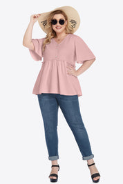 Plus size pink peplum V-neck blouse with ruffled button front