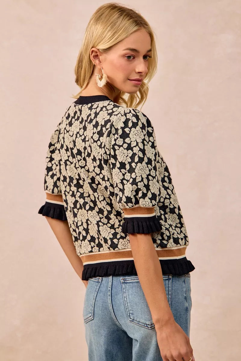BiBi Textured Rose Knit Top with black cream floral print and ruffled cuffs