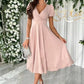 Soft pink surplice short sleeve midi dress with v-neck and puffed sleeves