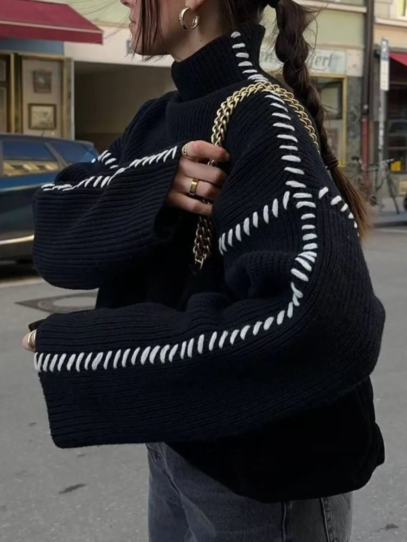 Black and white striped mock neck sweater with bell sleeves