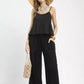 Black ruffled sleeveless Umgee top with scalloped edges and thin straps