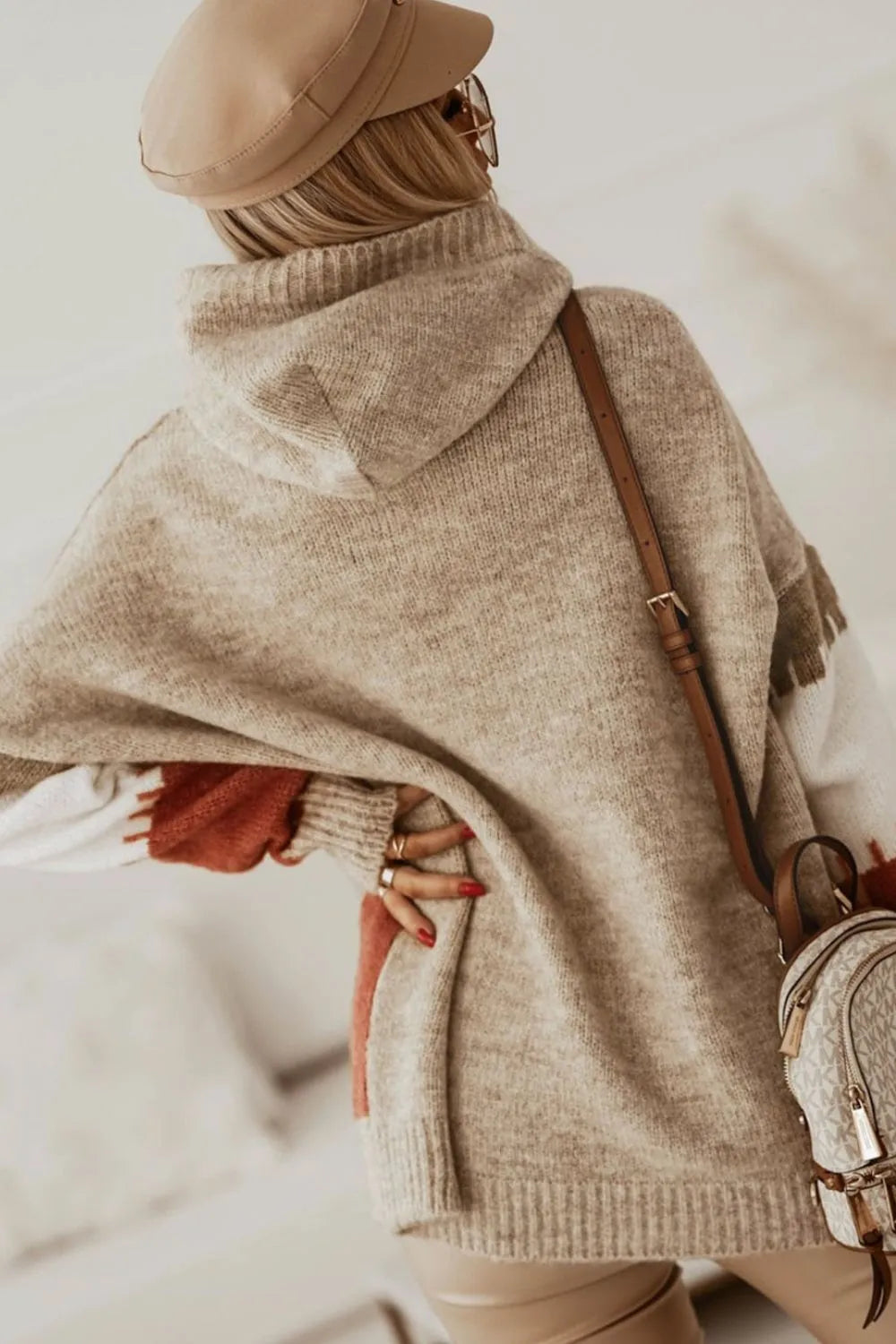 Beige oversized turtleneck sweater with fringe and crossbody bag