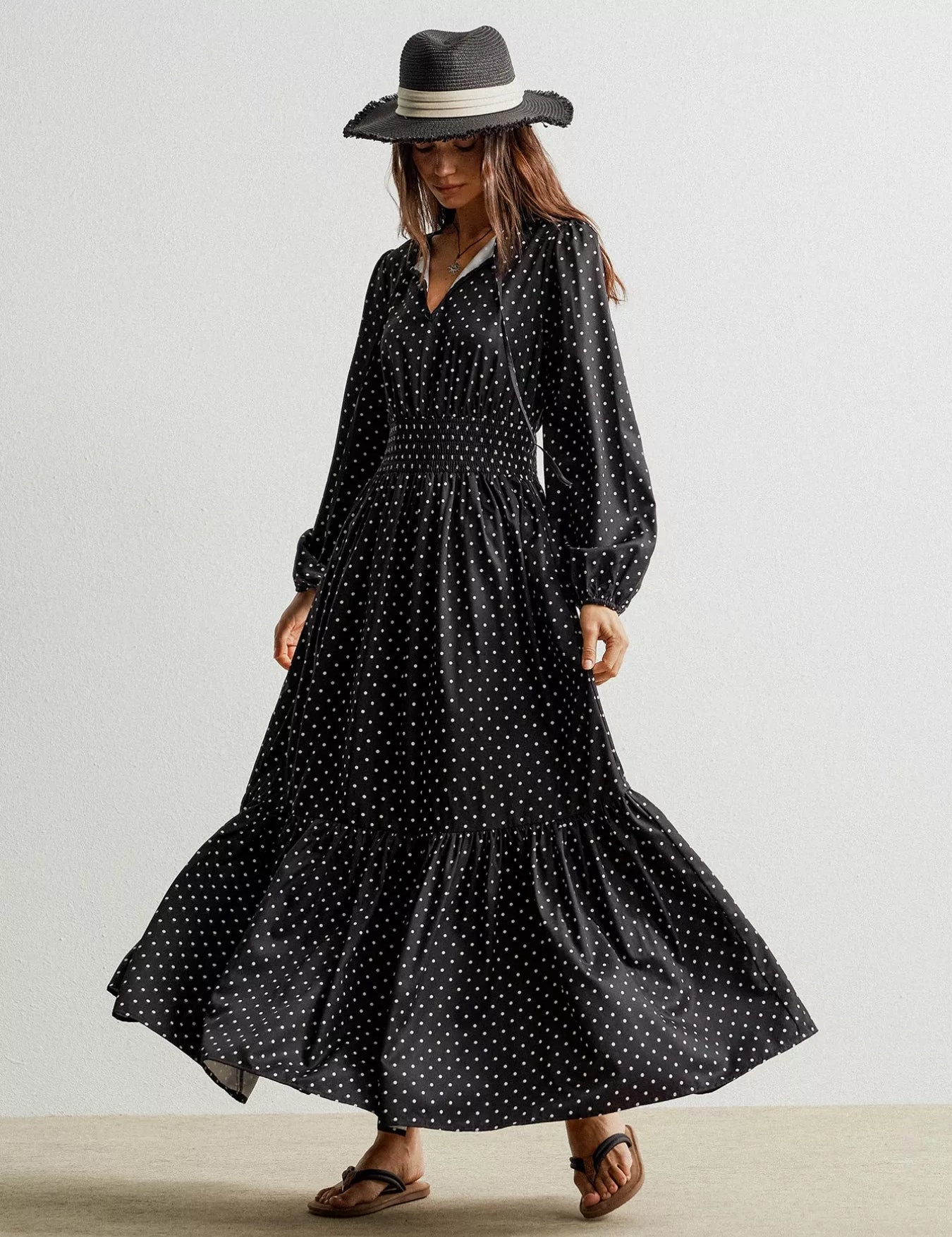 Black polka dot long sleeve maxi dress with wide-brimmed hat
