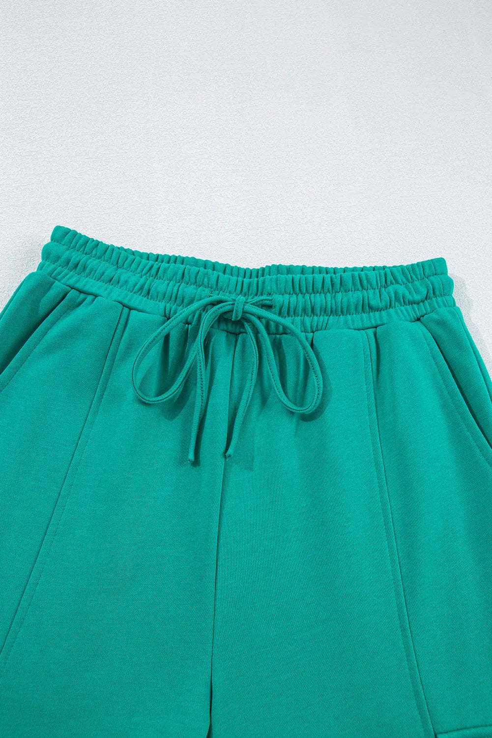 Green drawstring sweatpants in elastic ribbed fabric from long sleeve top set