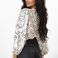Beige abstract print balloon sleeve crew neck blouse on woman