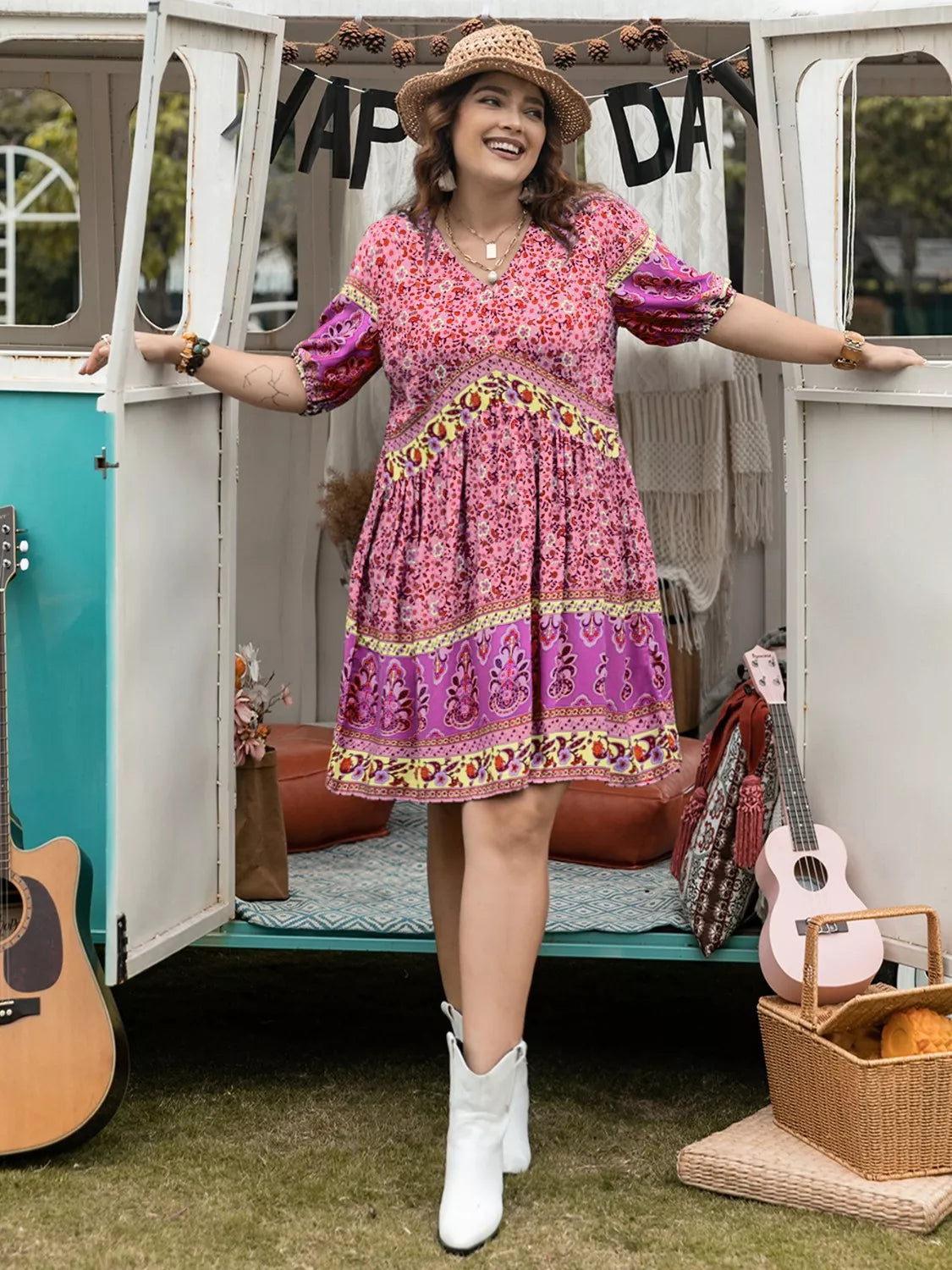 Plus size floral v-neck mini dress in pink, purple with gold trim