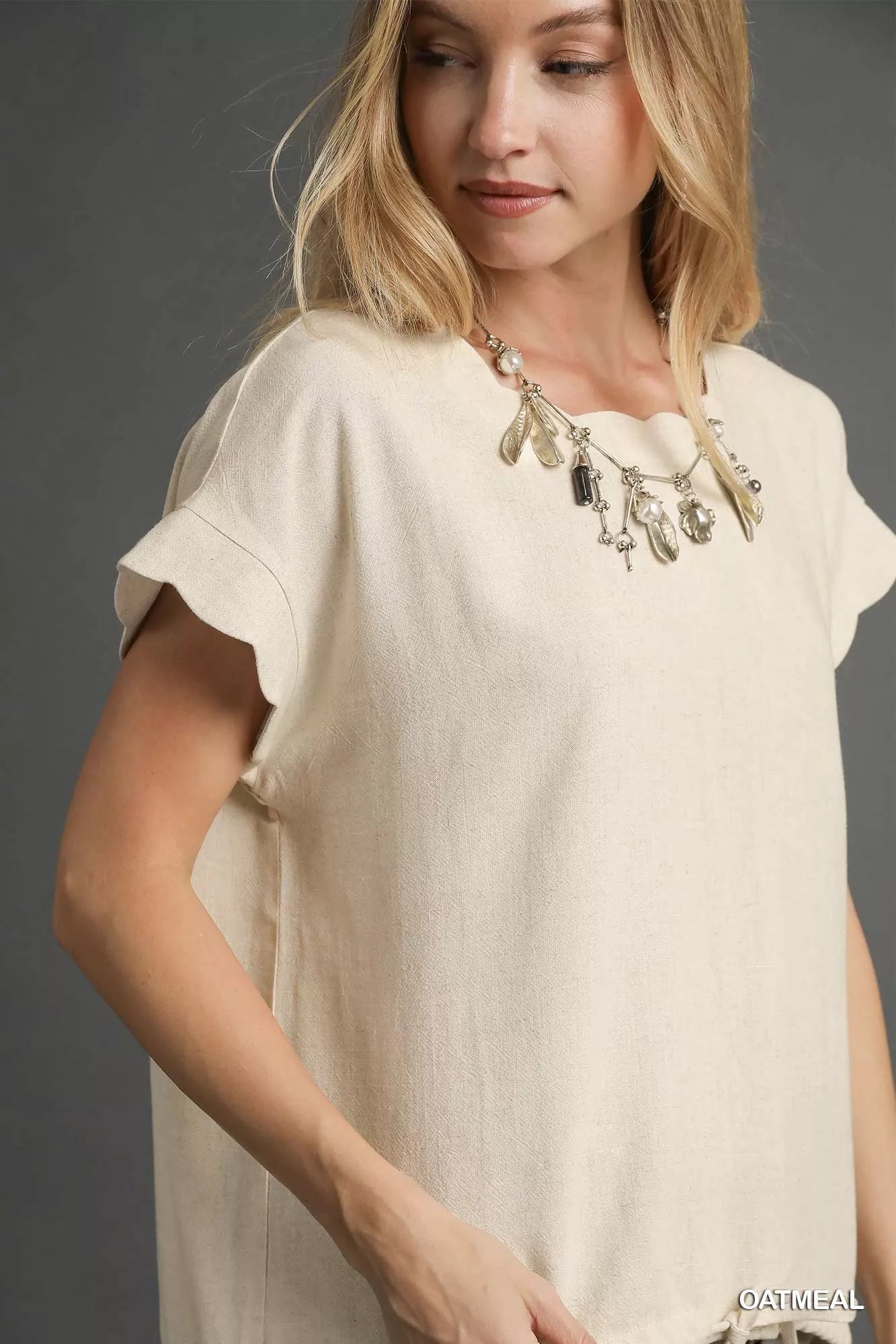 Umgee linen scalloped round neck top in cream textured fabric with flutter sleeves