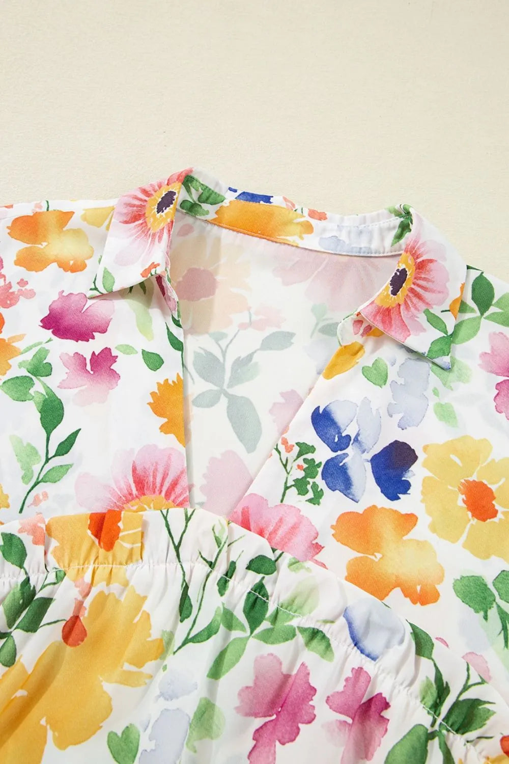 Floral boxy fit ruffled short sleeve blouse in vibrant watercolor print