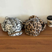 Two leopard print faux fur bucket bags in black/white and tan/brown
