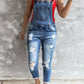 Daverri wide strap distressed denim overalls with ripped details and rolled cuffs