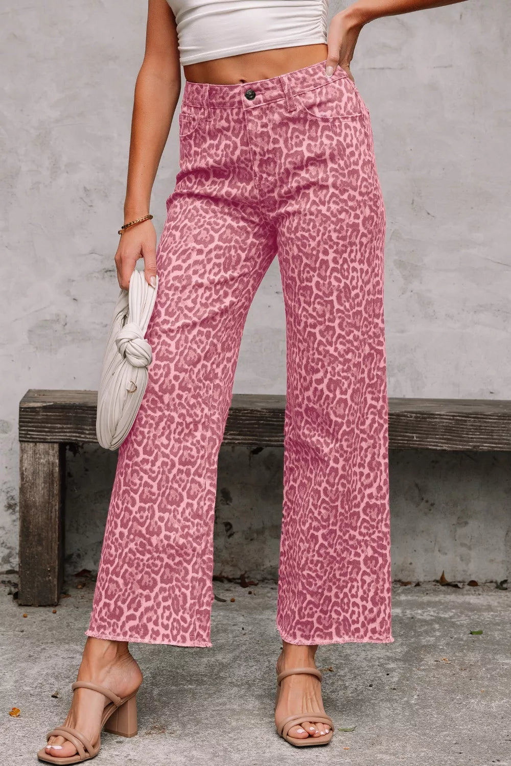 Pink leopard-print high-rise wide-leg jeans with frayed edges