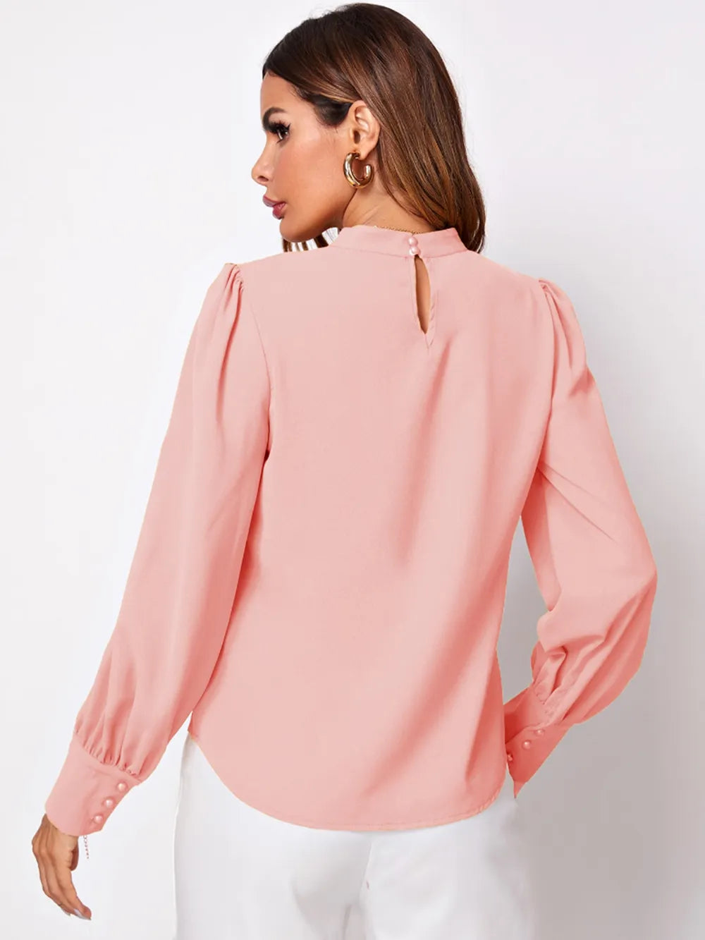 Ruched mock neck long sleeve blouse in soft pink with puffed shoulders