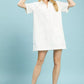 White eyelet cotton Umgee shift dress with short sleeves, collar, and pocket
