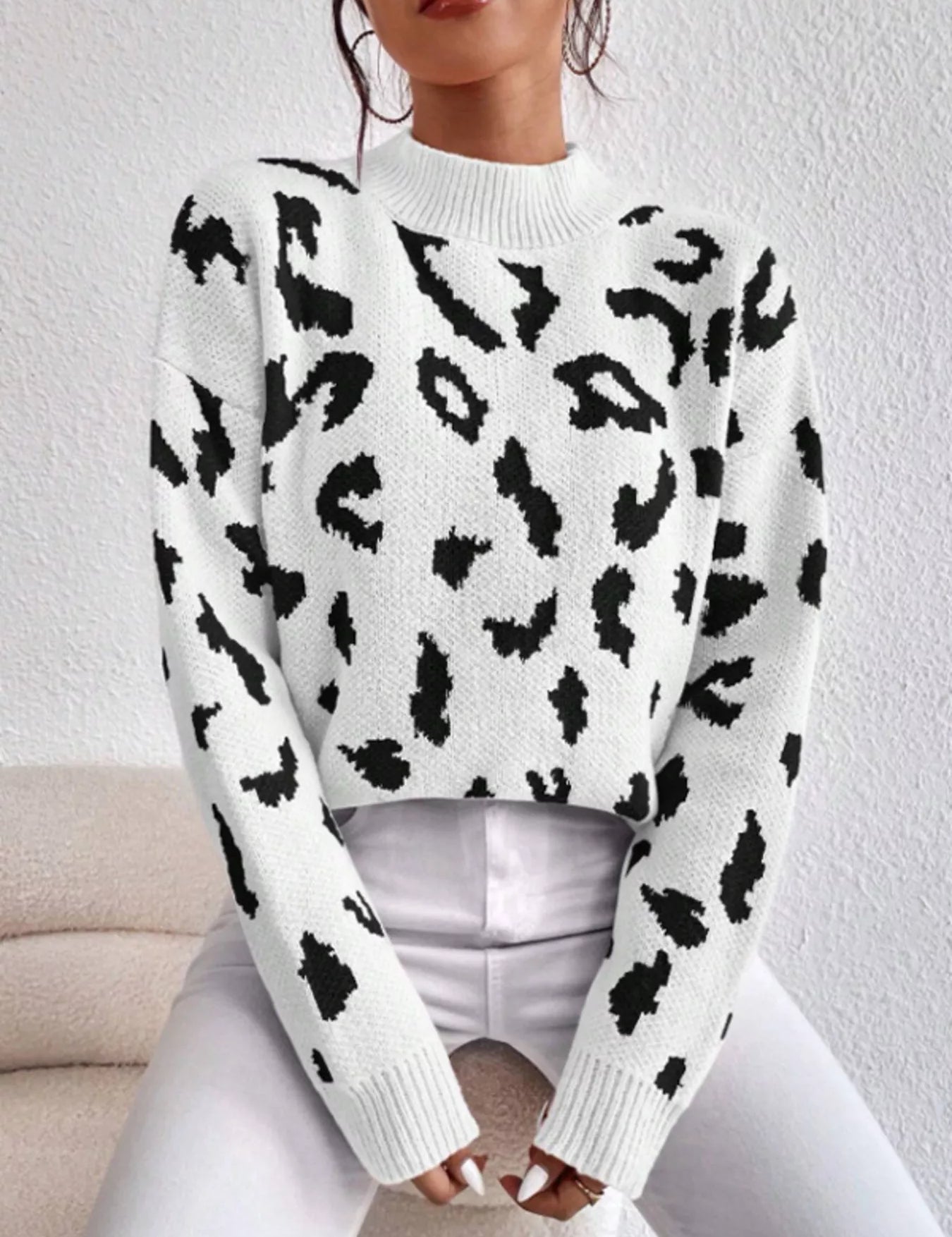 Leopard mock neck cropped sweater in white and black with ribbed cuffs