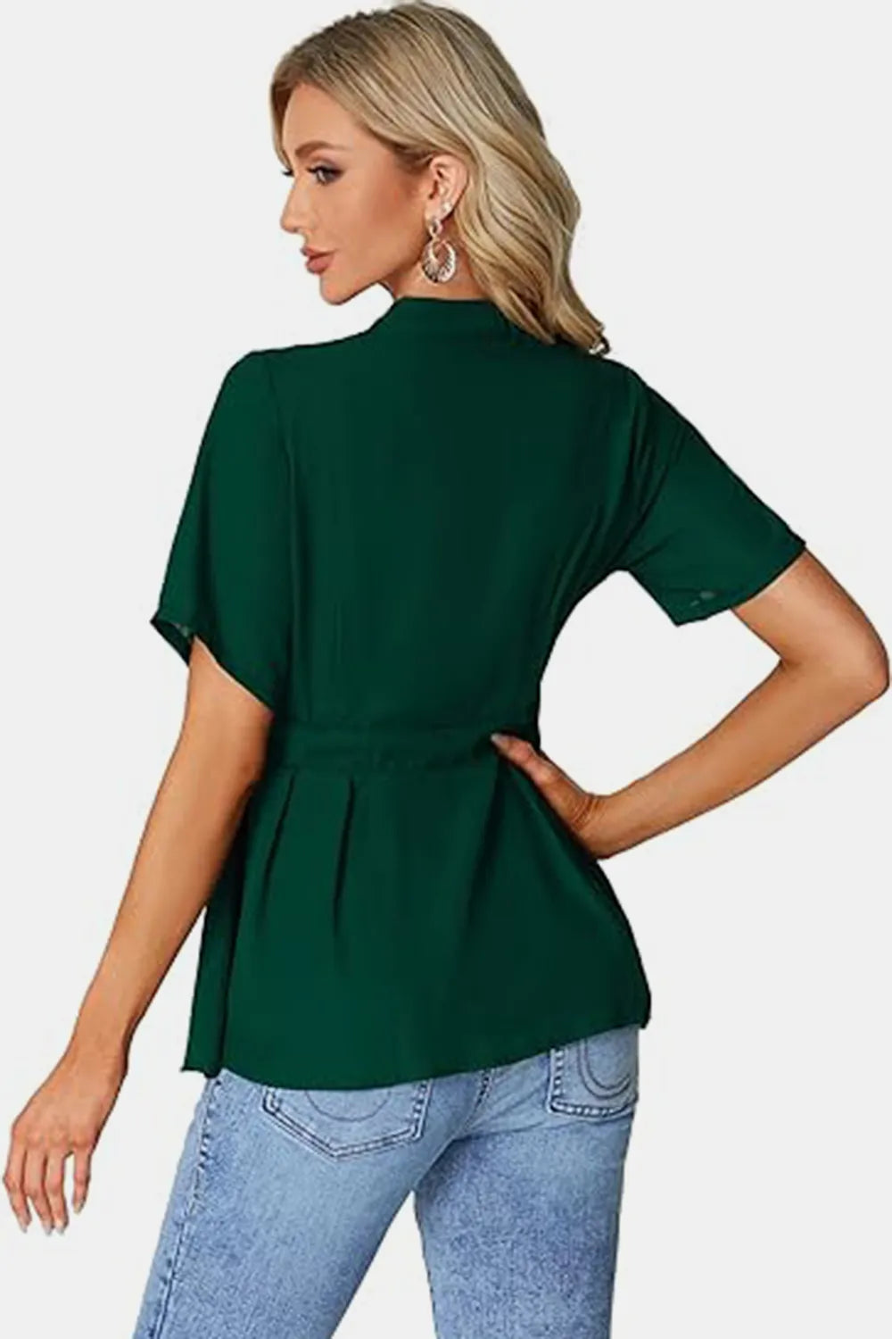 Dark green peplum top with tied round neck and flutter sleeves