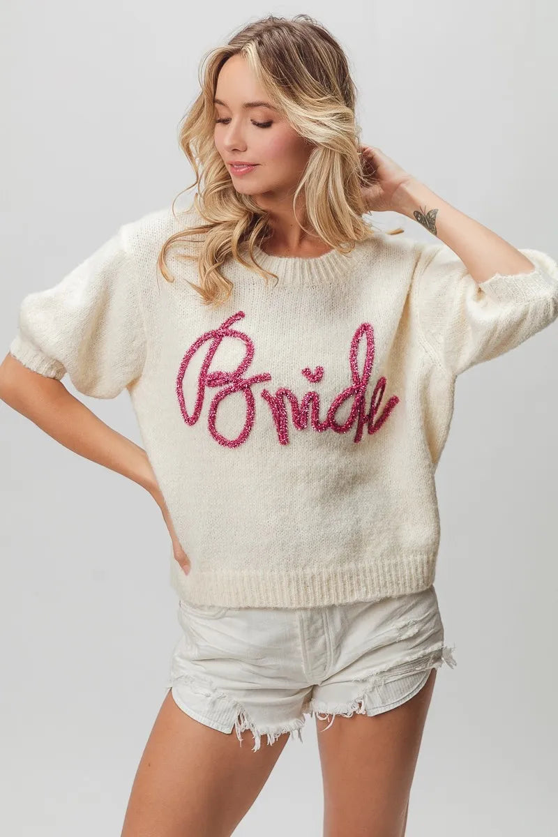 Cream-colored bride sweater with pink sequins and puff sleeves