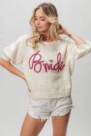 Cream-colored bride sweater with pink sequins and puff sleeves