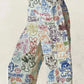 Cream printed wide-leg jeans with colorful graffiti cartoon pattern
