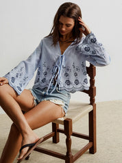 Blue floral embroidered boho blouse with bell sleeves and tie front