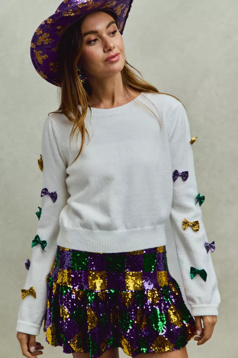 SO ME Mardi Gras sweater with purple, green, gold sequined bow sleeves