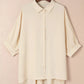 Cream-colored lightweight cotton women’s 3/4 sleeve button-up oversized blouse