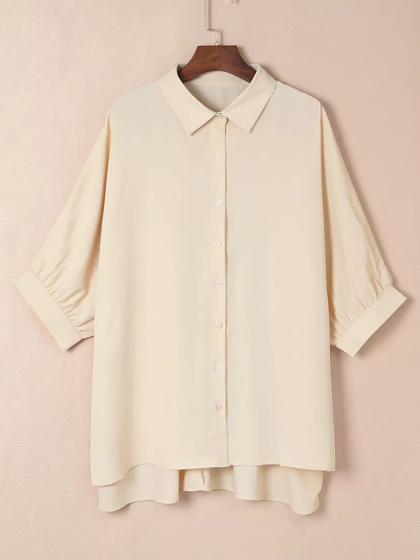 Cream-colored lightweight cotton women’s 3/4 sleeve button-up oversized blouse