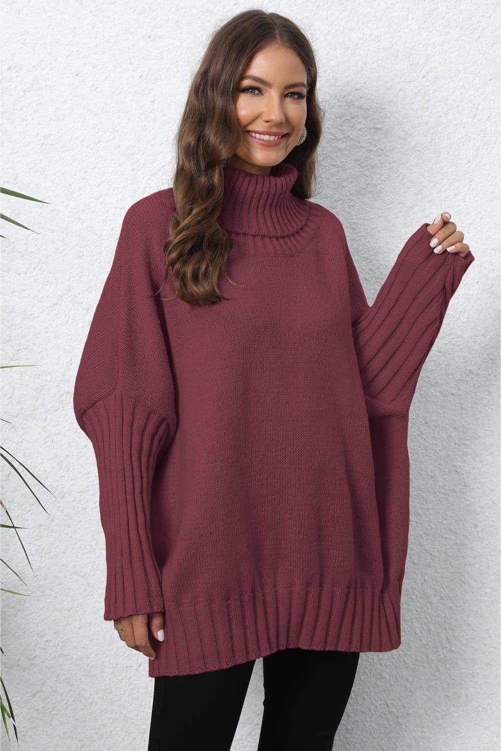 Oversized maroon turtleneck sweater with cable knit sleeve details
