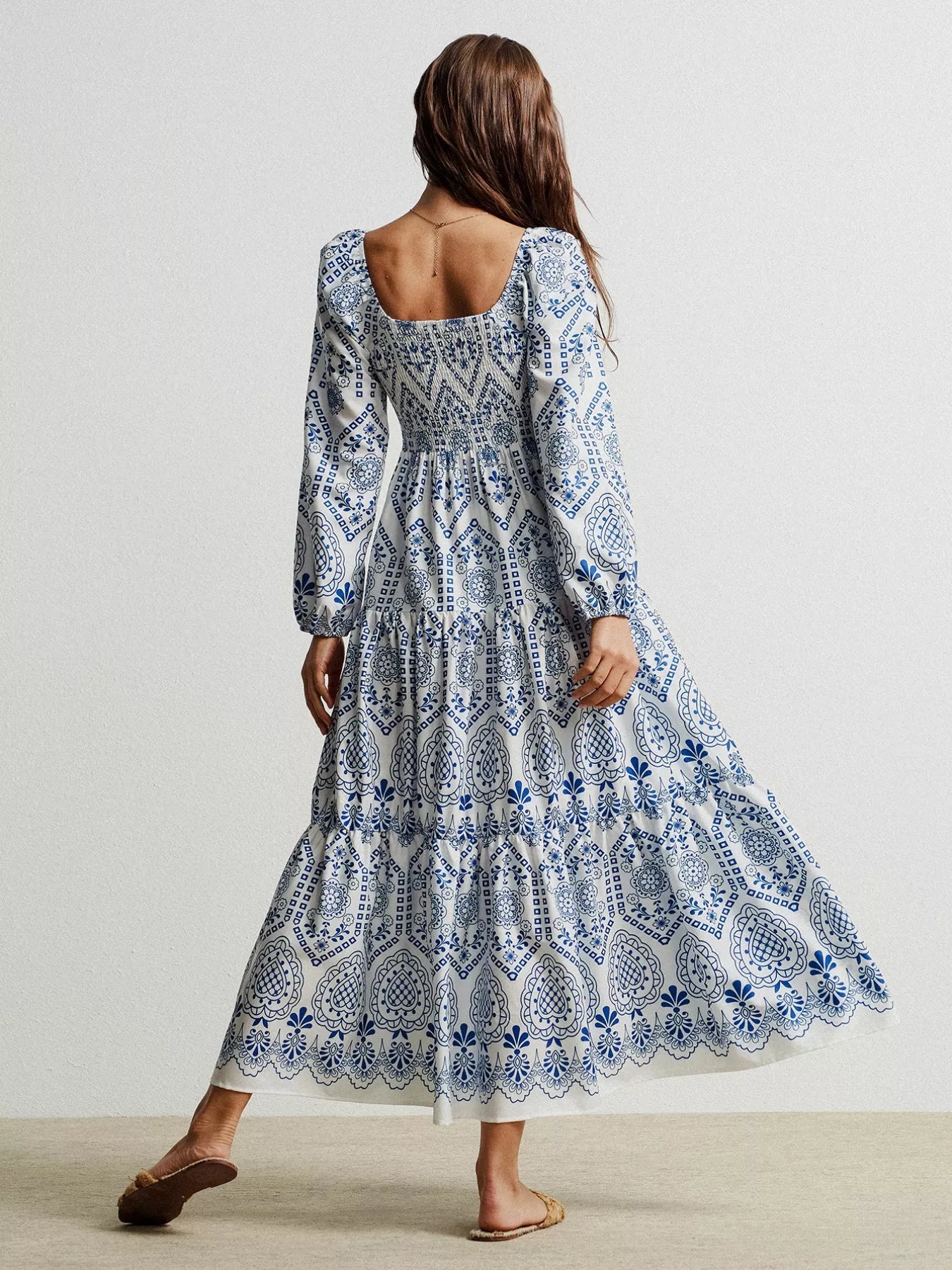 Blue and white floral embroidered long-sleeve maxi dress with tassel detail