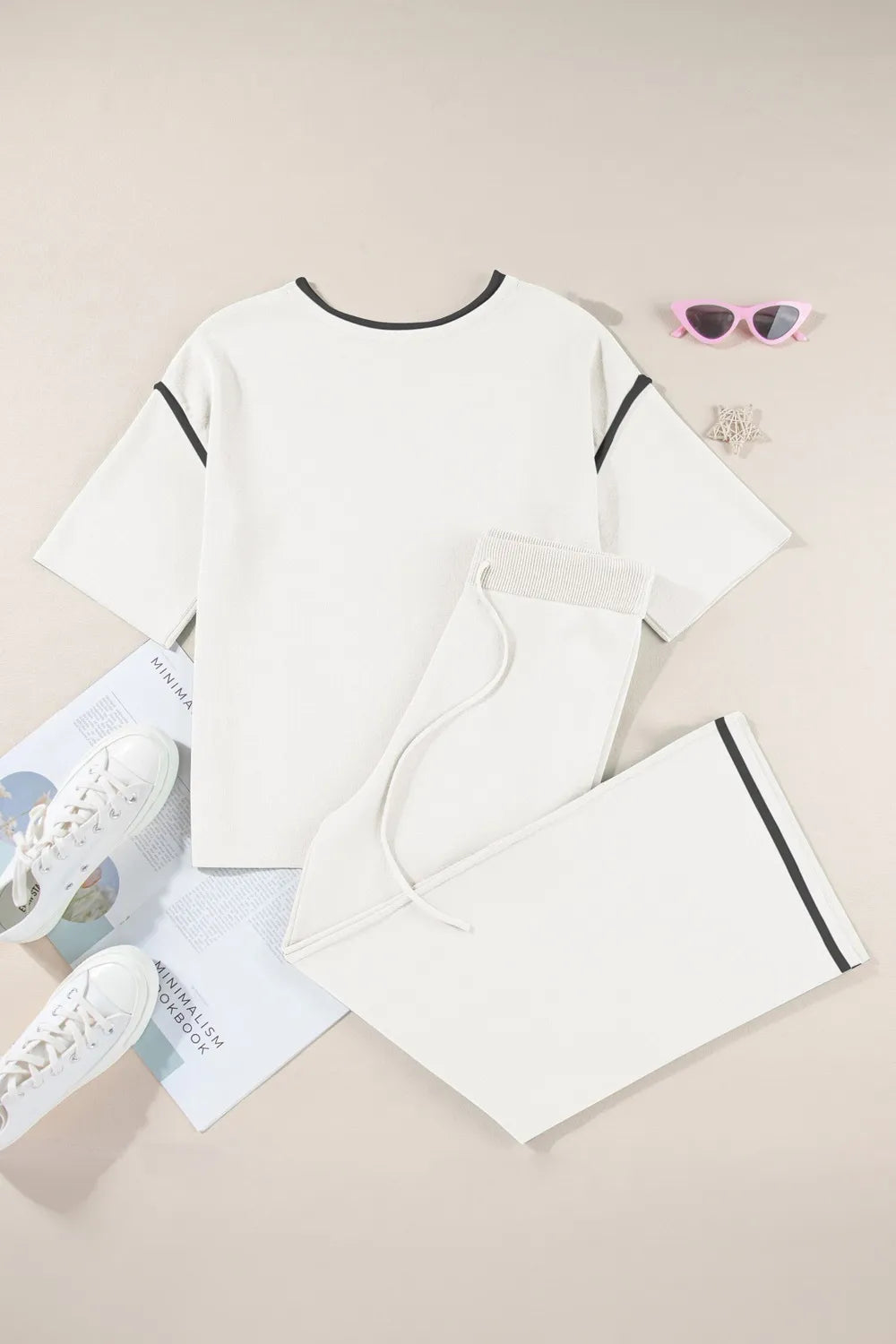 White cotton t-shirt with black trim and contrast stitching in minimalist set