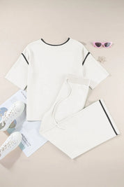 White cotton t-shirt with black trim and contrast stitching in minimalist set