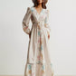 Off-white floral maxi dress with smocked waist, lace hem, straw hat