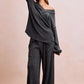 Dark gray ribbed off-shoulder V-neck top with long sleeves, relaxed fit