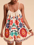 Floral print spaghetti strap romper in vibrant off-white with embroidered blossoms