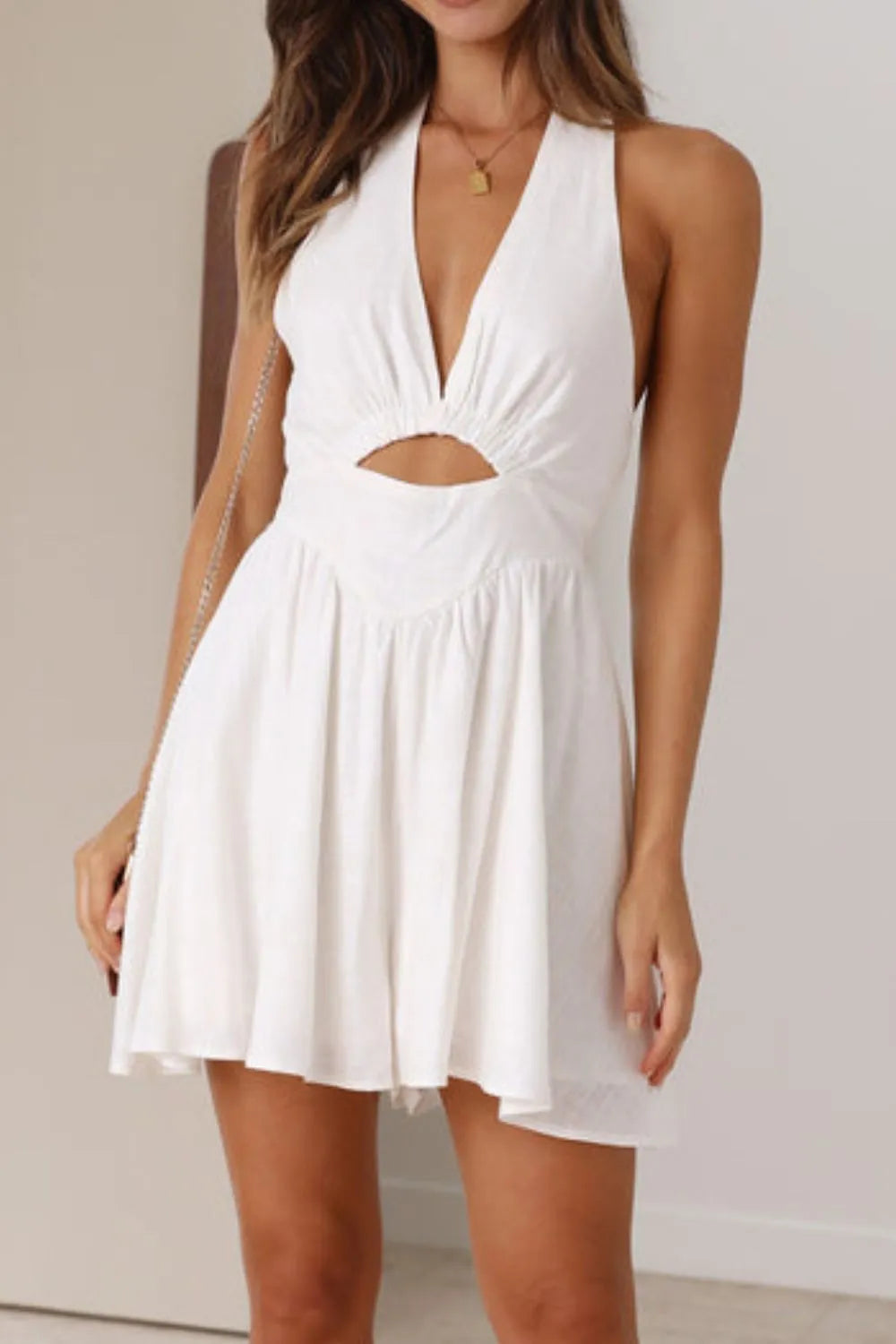 Daverri cutout halter neck mini dress with deep v-cut and waist cutout