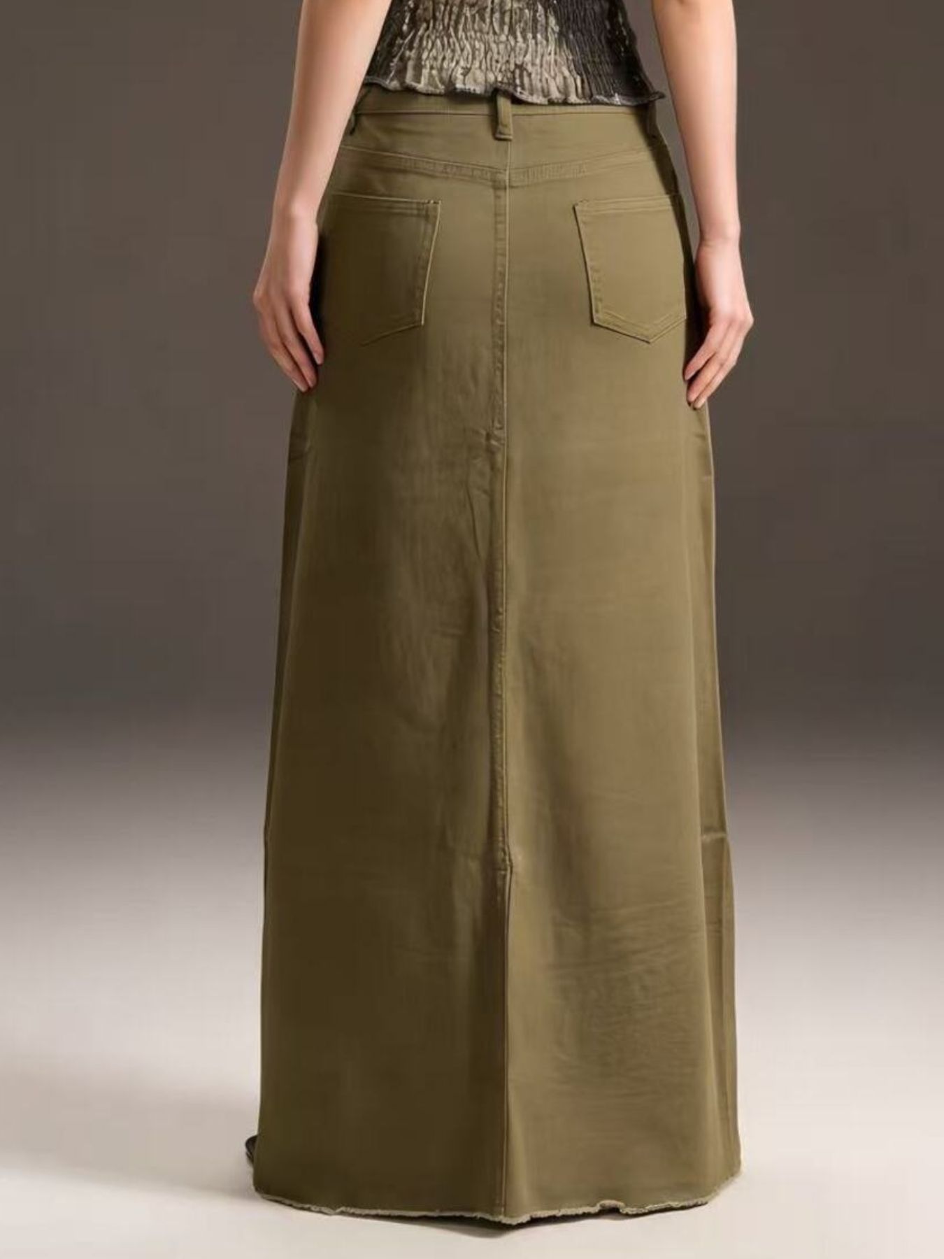 Olive green raw hem maxi denim skirt with back pockets and straight hem