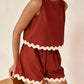 Daverri Fashions women’s rust sleeveless top and shorts set with cream trim