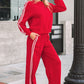 Red womens crewneck sweatsuit set with white stripes on sleeves and legs