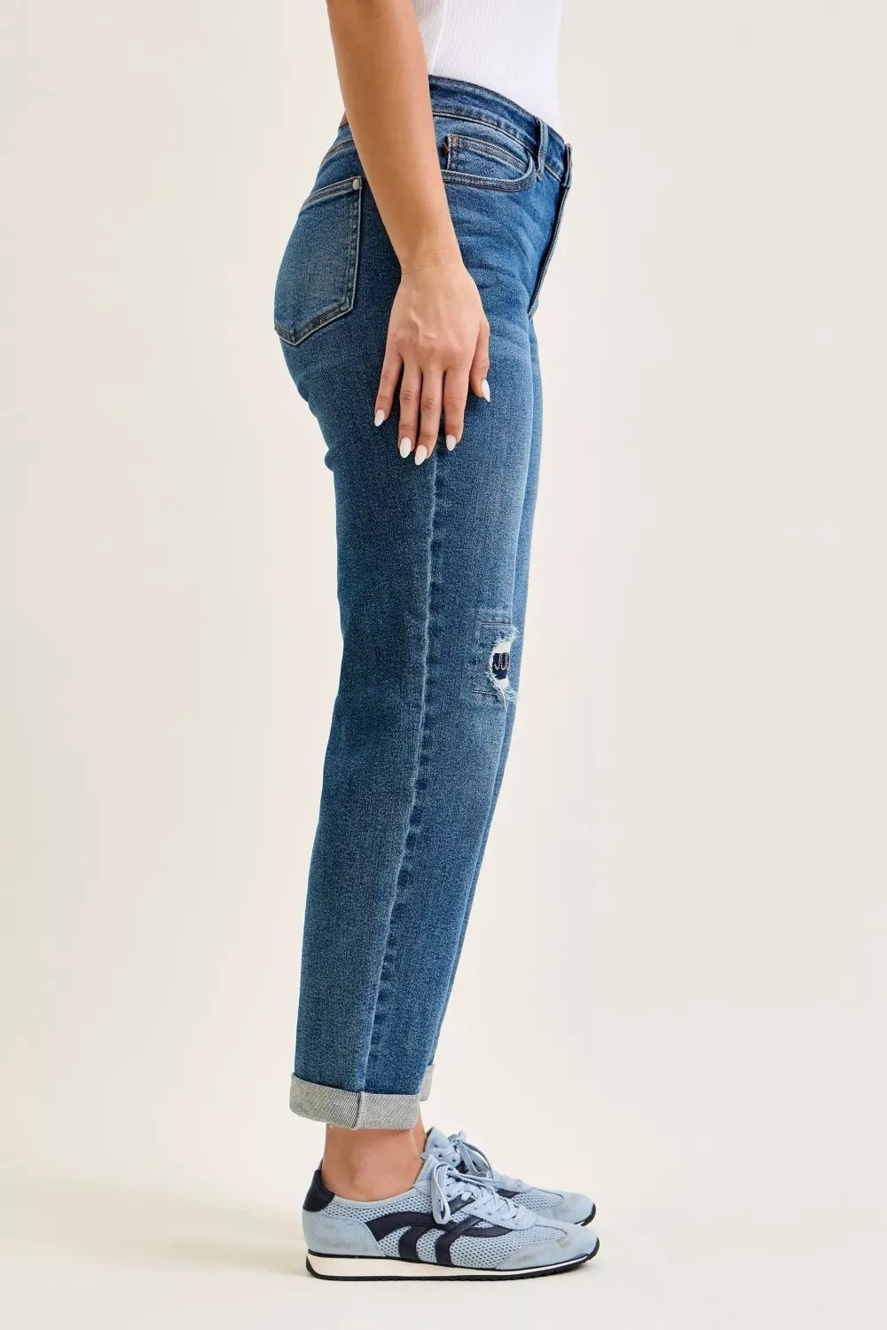 Judy Blue mid-rise boyfriend jeans with high-waisted blue denim, distressed knee patch, and rolled cuffs