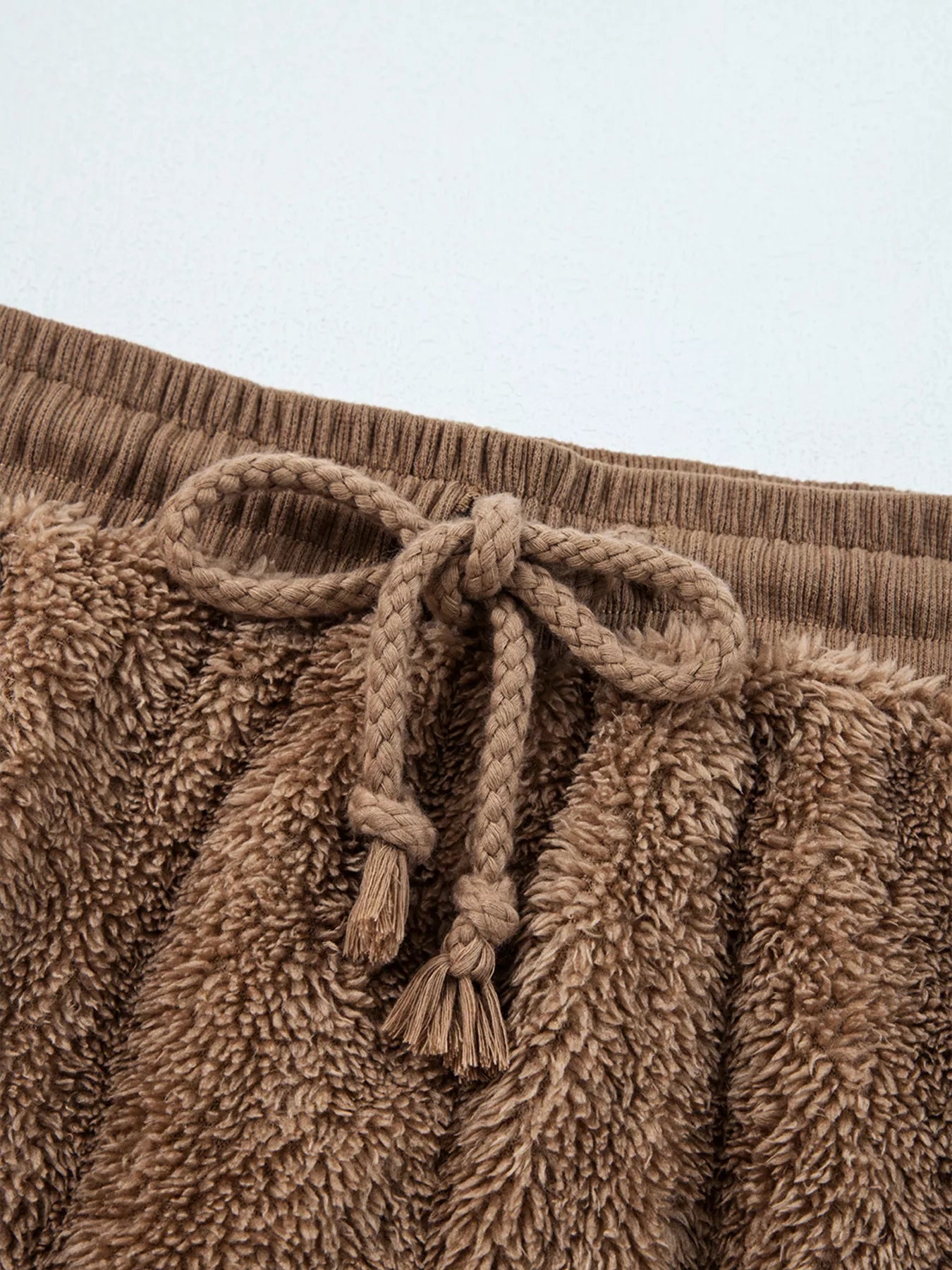 Brown fuzzy drawstring sweatpants with rope tie cord