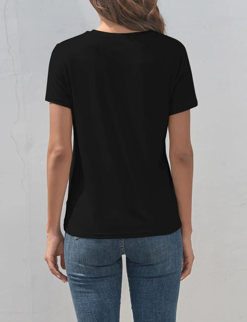Black short-sleeved Dragonfly graphic t-shirt with round neckline and jeans