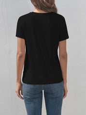 Black short-sleeved Dragonfly graphic t-shirt with round neckline and jeans