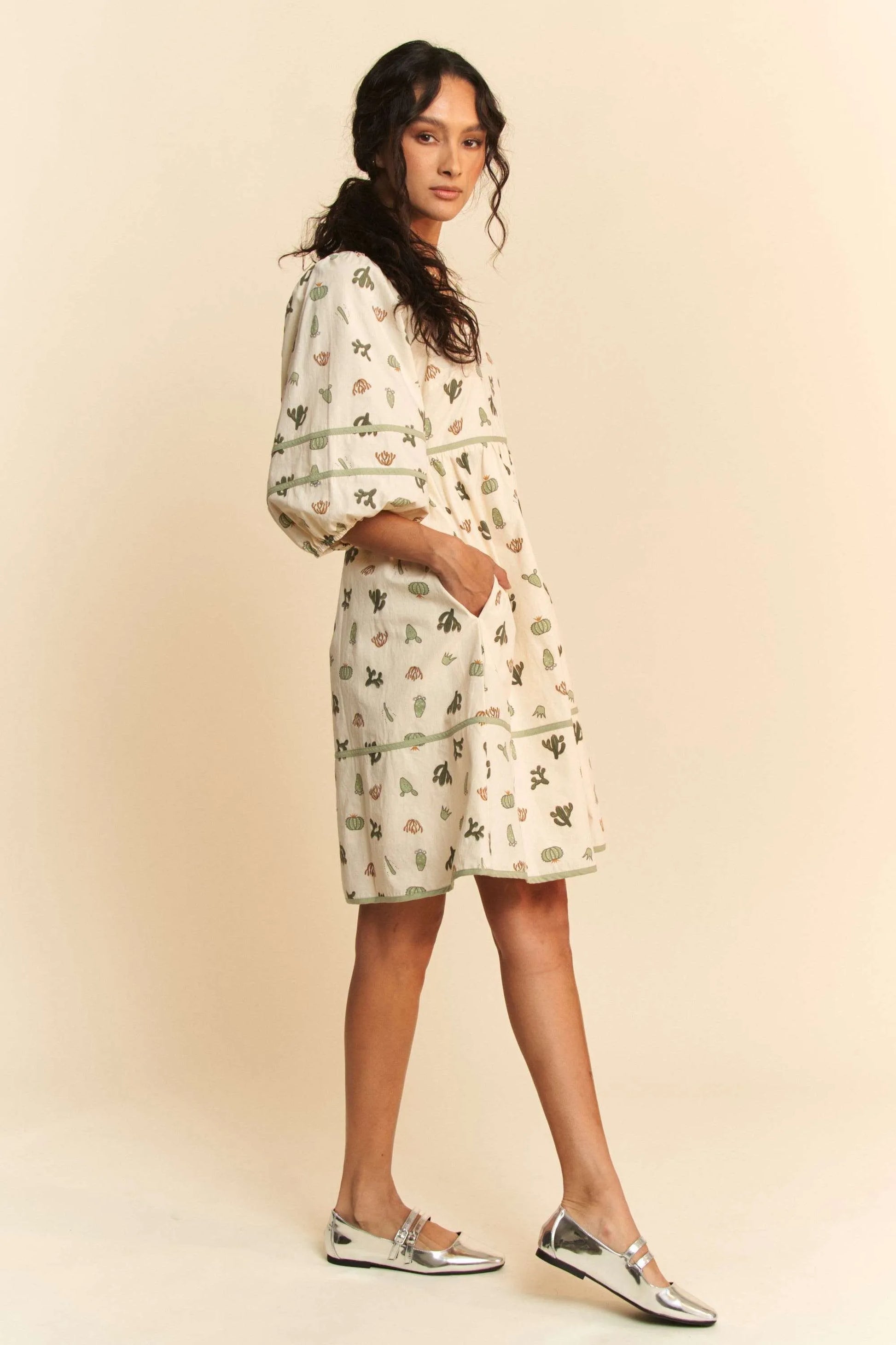 Woman in Davi & Dani cactus printed poplin mini dress with sea creatures