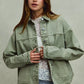 Vintage washed olive green denim shacket with frayed hem and buttons
