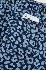 Leopard print wide leg jeans with white stitching and button closure