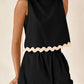 Daverri Fashions black sleeveless top with cream scalloped hem